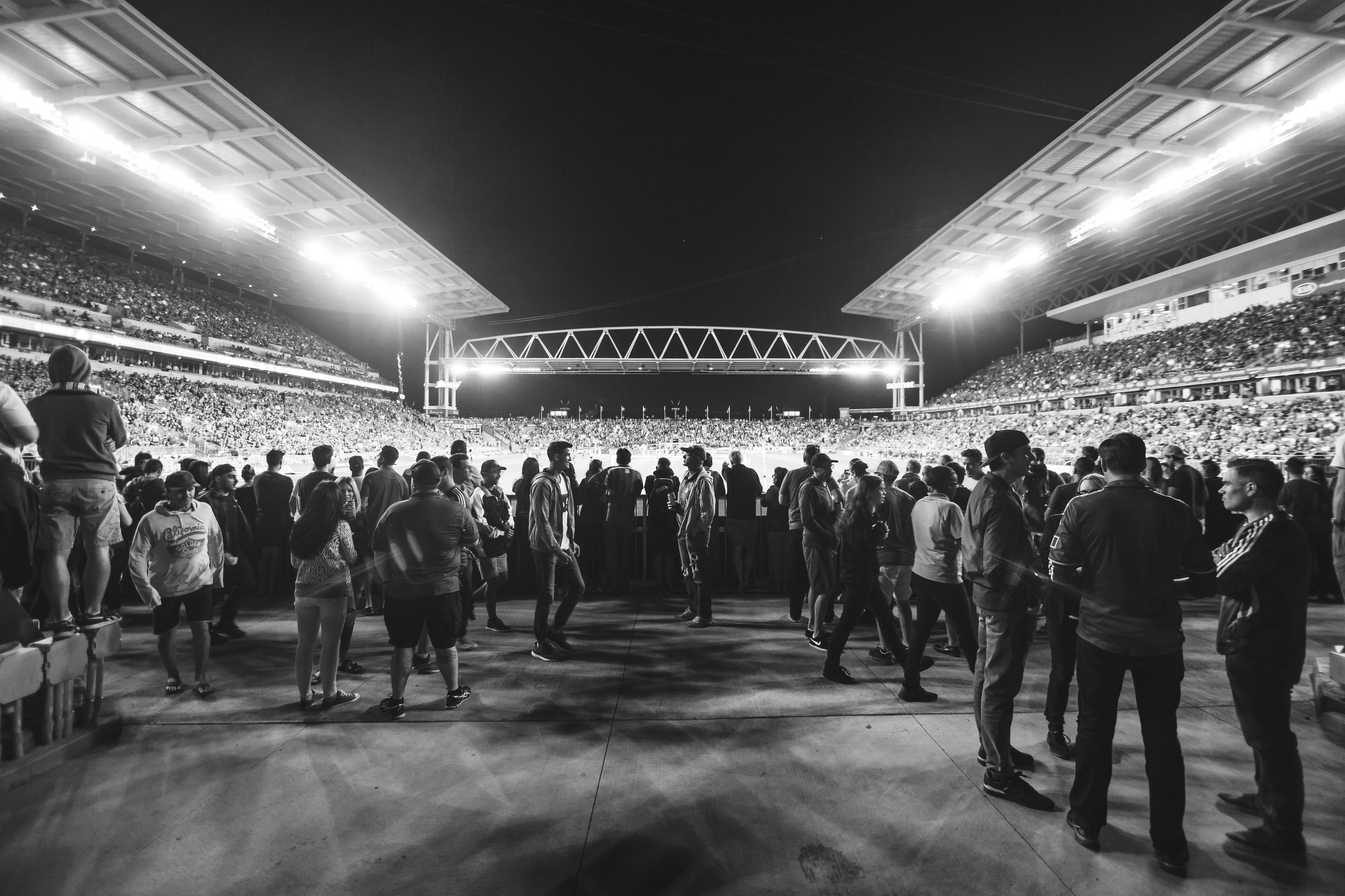 Black and white photo of football stadium and crowd